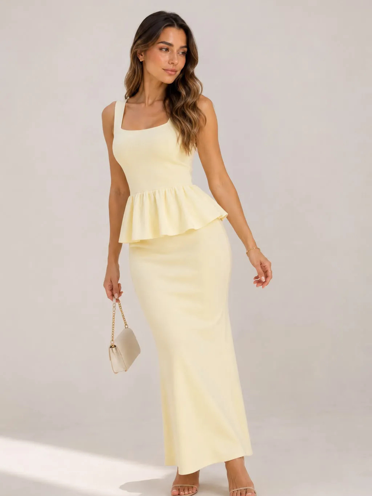 Conjunto de tricô Pantanal em duas peças: blusa com peplum e saia longa